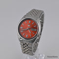 Seiko 5 7009 burnt orange Arabic dial — front left
