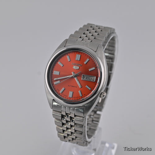 Seiko 5 7009 burnt orange Arabic dial — front left
