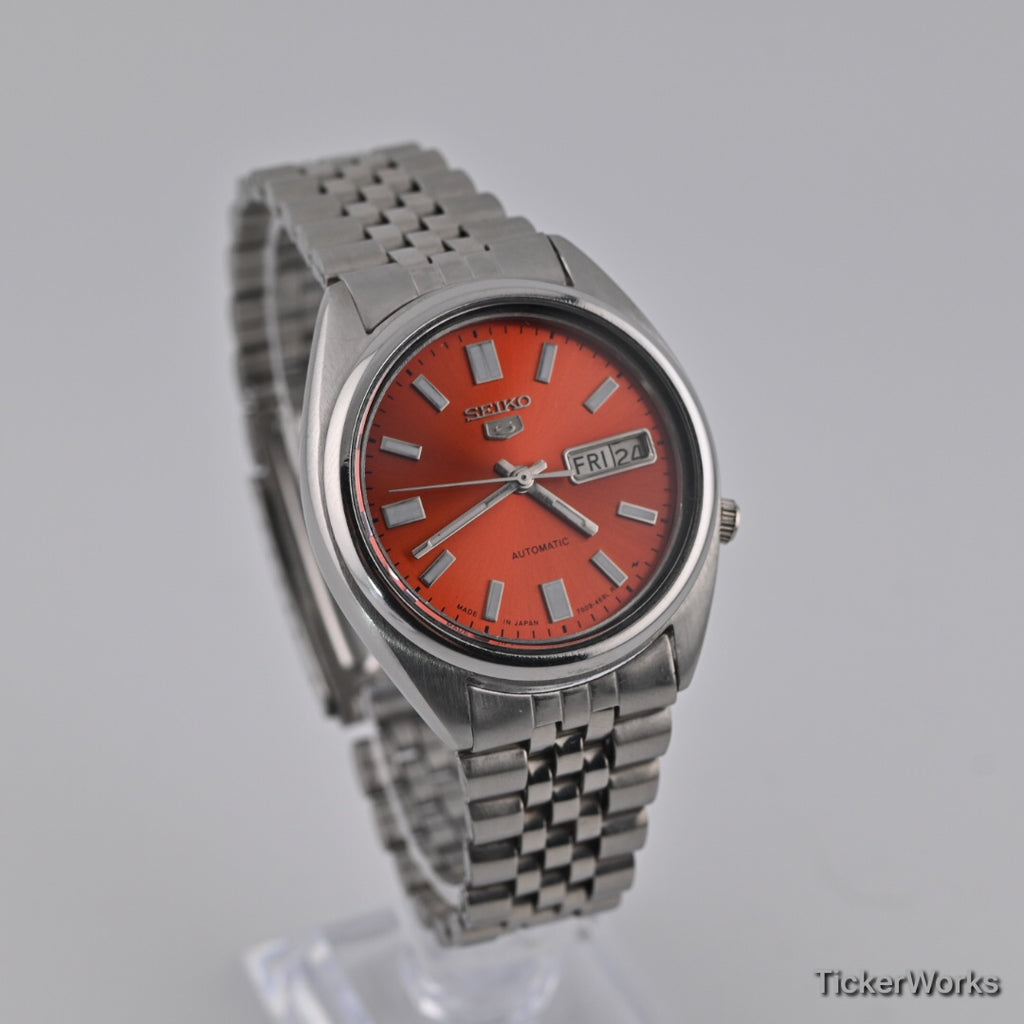 Seiko 5 7009 burnt orange Arabic dial — front right
