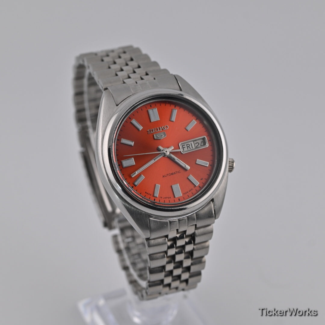 Seiko 5 7009 burnt orange Arabic dial — front right
