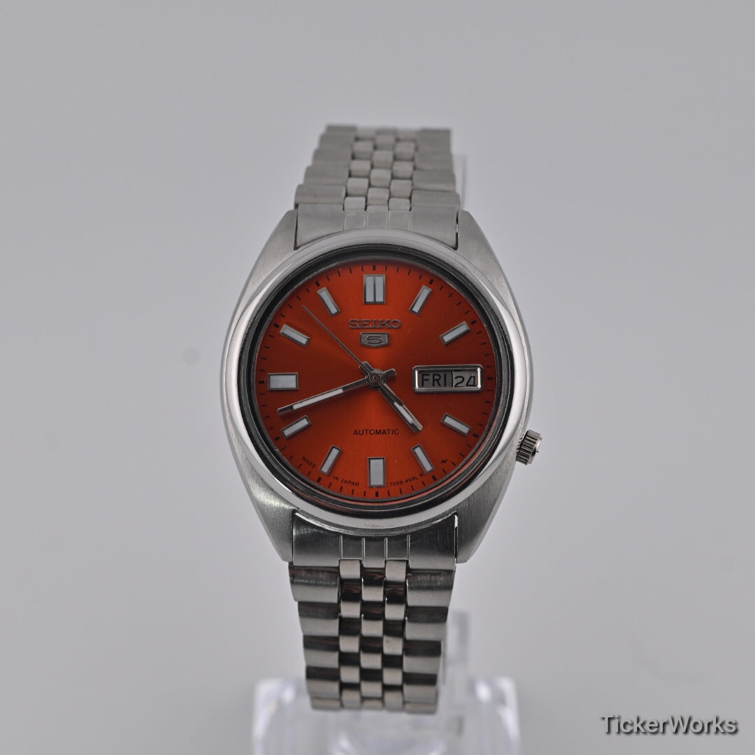 Seiko 5 7009 burnt orange Arabic dial — dial
