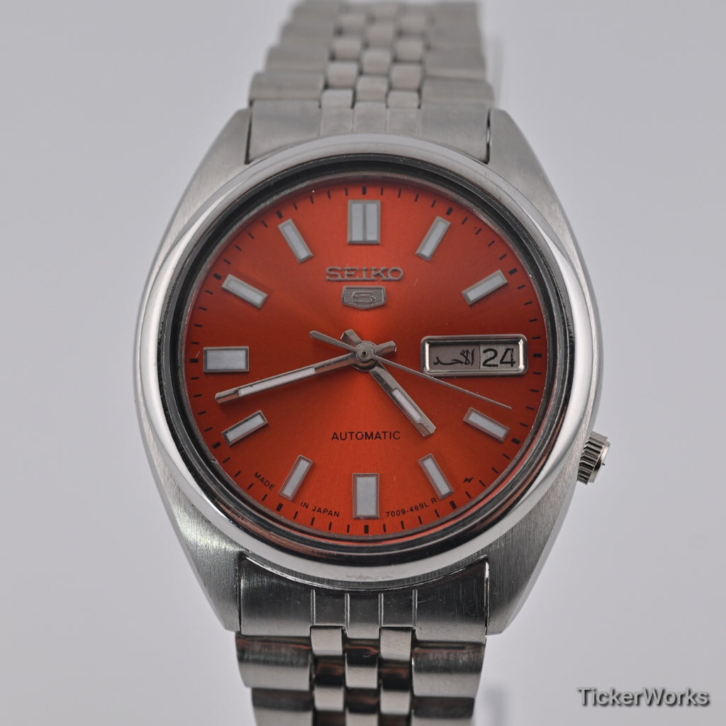 Seiko 5 7009 burnt orange Arabic dial — dial close alt

